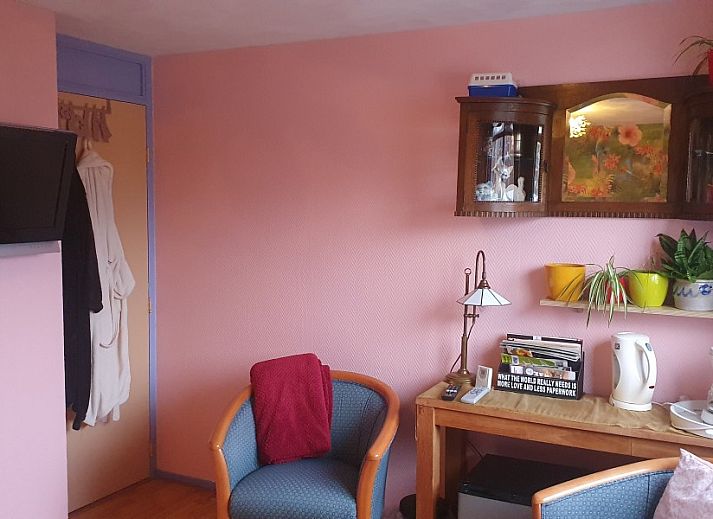 Bright bedroom at Susanna's bedandbreakfast in Emmen, featuring modern conveniences and inviting decor.