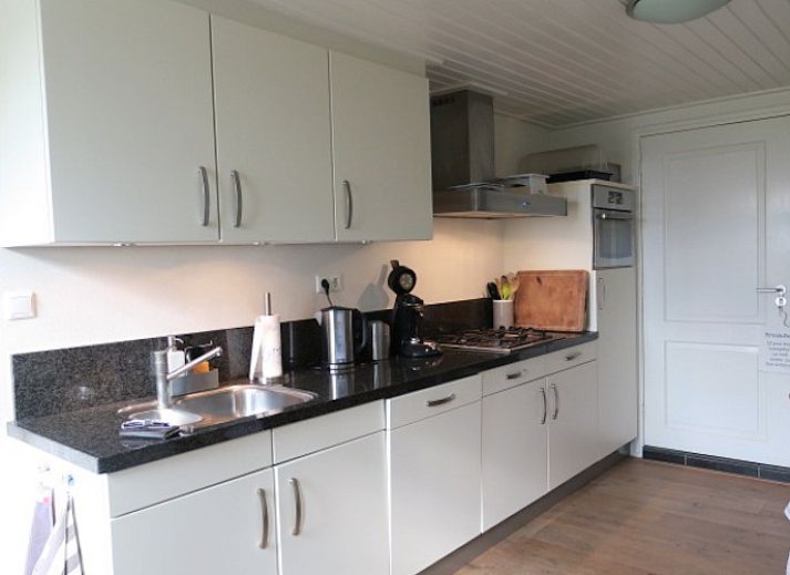 Seppenstijn vakantiehuis in Ruinerwold, Drenthe, met ruime tuin en weelderige natuur.