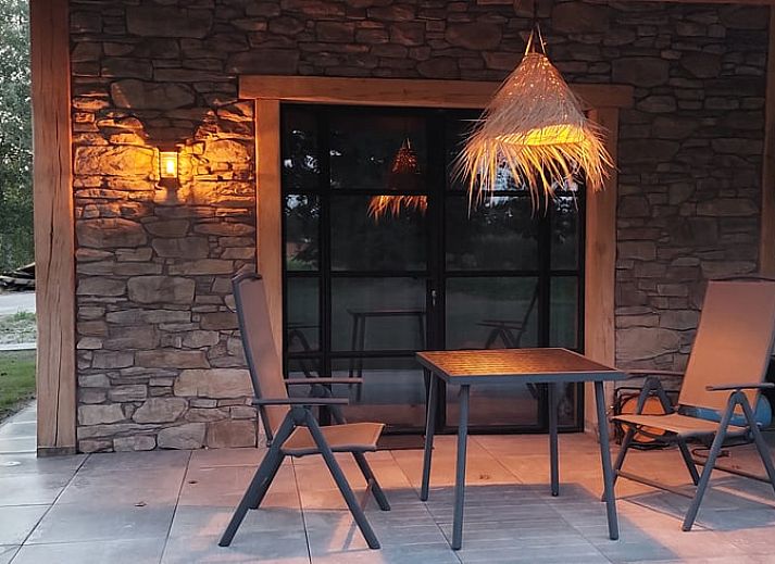 Exterior of Holiday home in Stroe with wooden facade, located in the Veluwe.