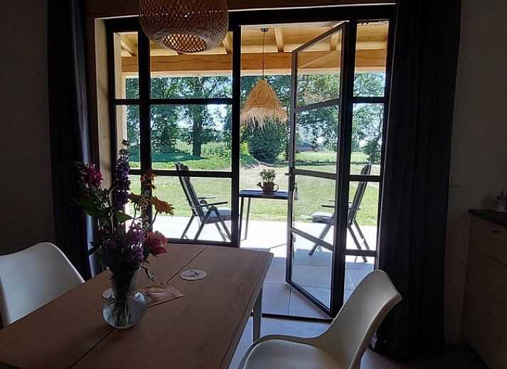 Exterior of Holiday home in Stroe with wooden facade, located in the Veluwe.