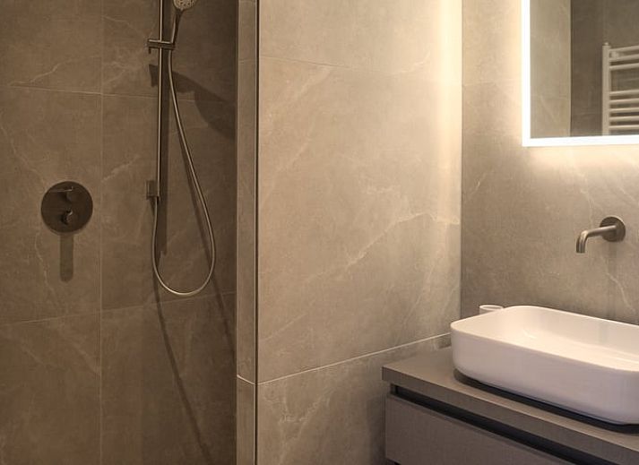 Hanging flower baskets and colorful flowers at Holiday home in Oldenzaal, a rustic stay in Twente.