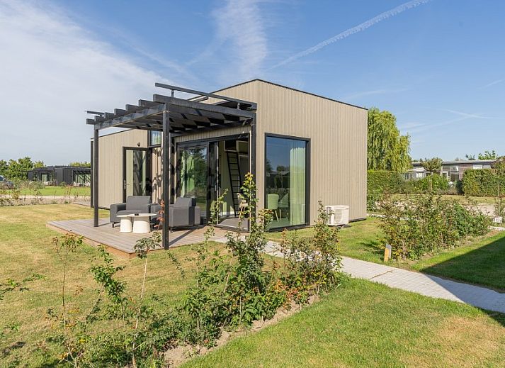 Bright bedroom overlooking green fields at Buitenplaats Hotel, bed and breakfast in Ellemeet, Schouwen-Duiveland, Zeeland.