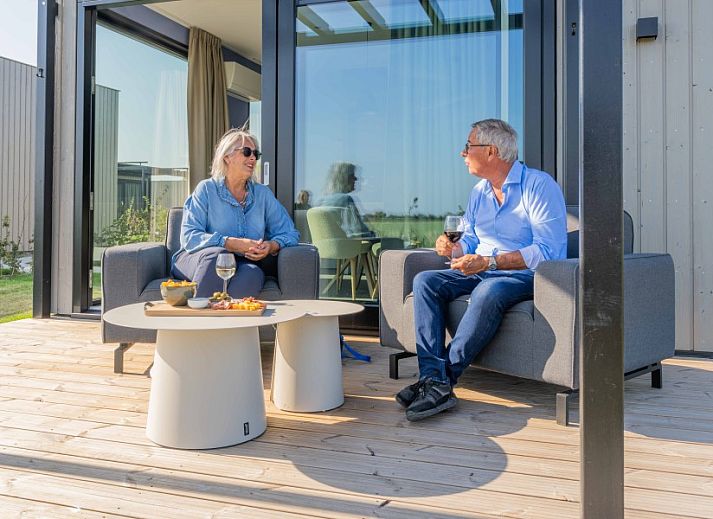 Bright bedroom overlooking green fields at Buitenplaats Hotel, bed and breakfast in Ellemeet, Schouwen-Duiveland, Zeeland.