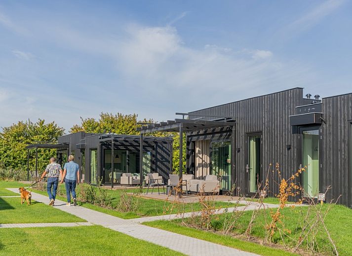 Bright bedroom overlooking green fields at Buitenplaats Hotel, bed and breakfast in Ellemeet, Schouwen-Duiveland, Zeeland.