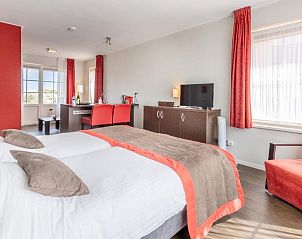 Zithoek met comfortabele stoelen in Bed & Breakfast Huys aan zee, Domburg.