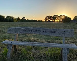 Prachtig uitzicht op zonsondergang vanaf bankje bij Vakantiehuisje in Beemte Broekland, Veluwe, Gelderland.